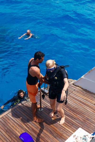 HURGHADA EGYPT - MAY 19 2015: Scuba diving instructor checking equipment before dive.